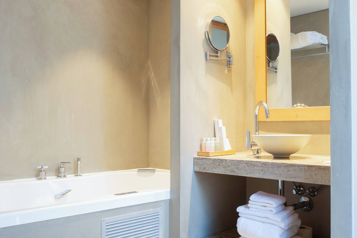 luxury suite, garden view | bathroom | designer toiletries, hair dryer, bathrobes, slippers