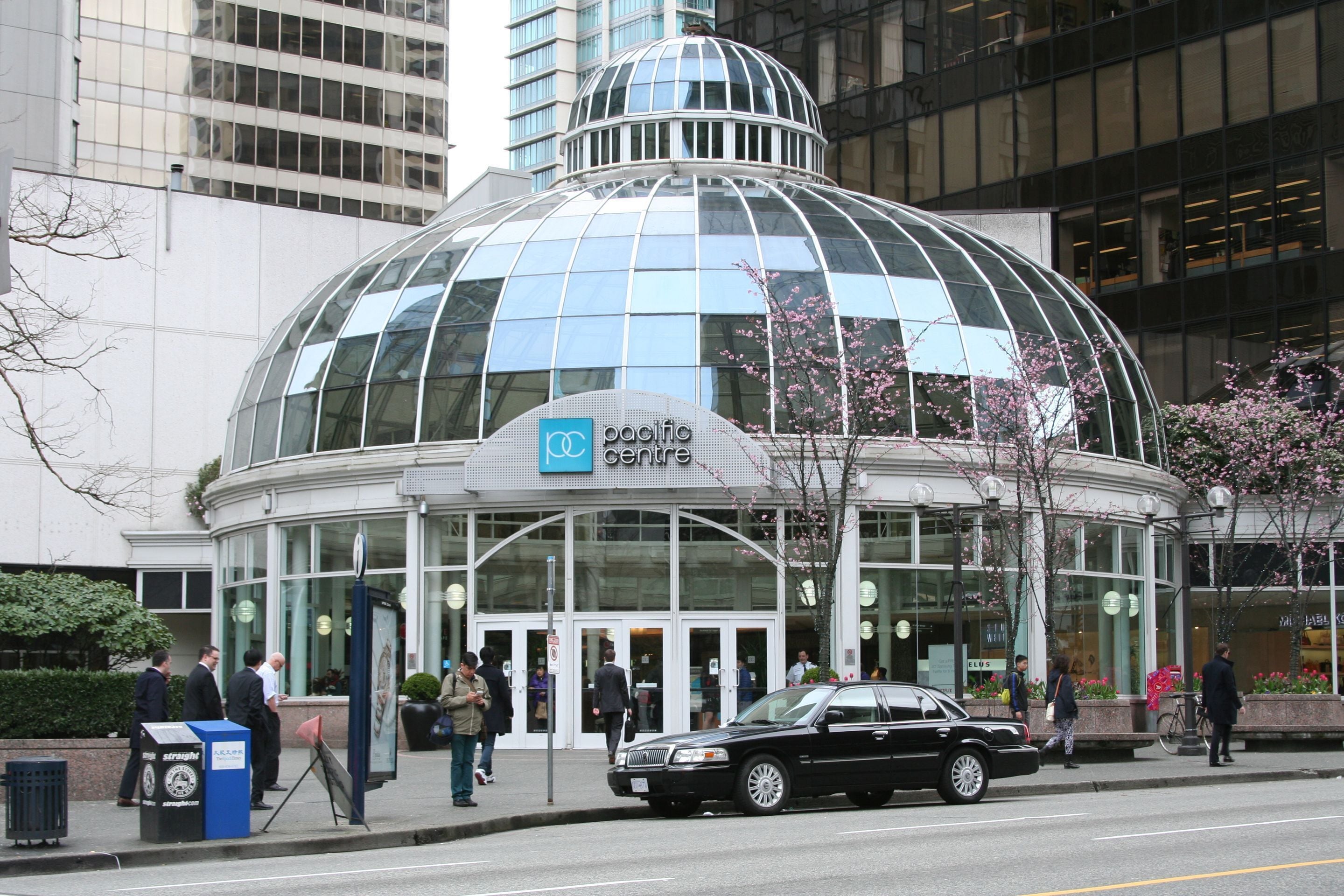 A modern building with a large glass dome and a sign reading "Pacific Centre".