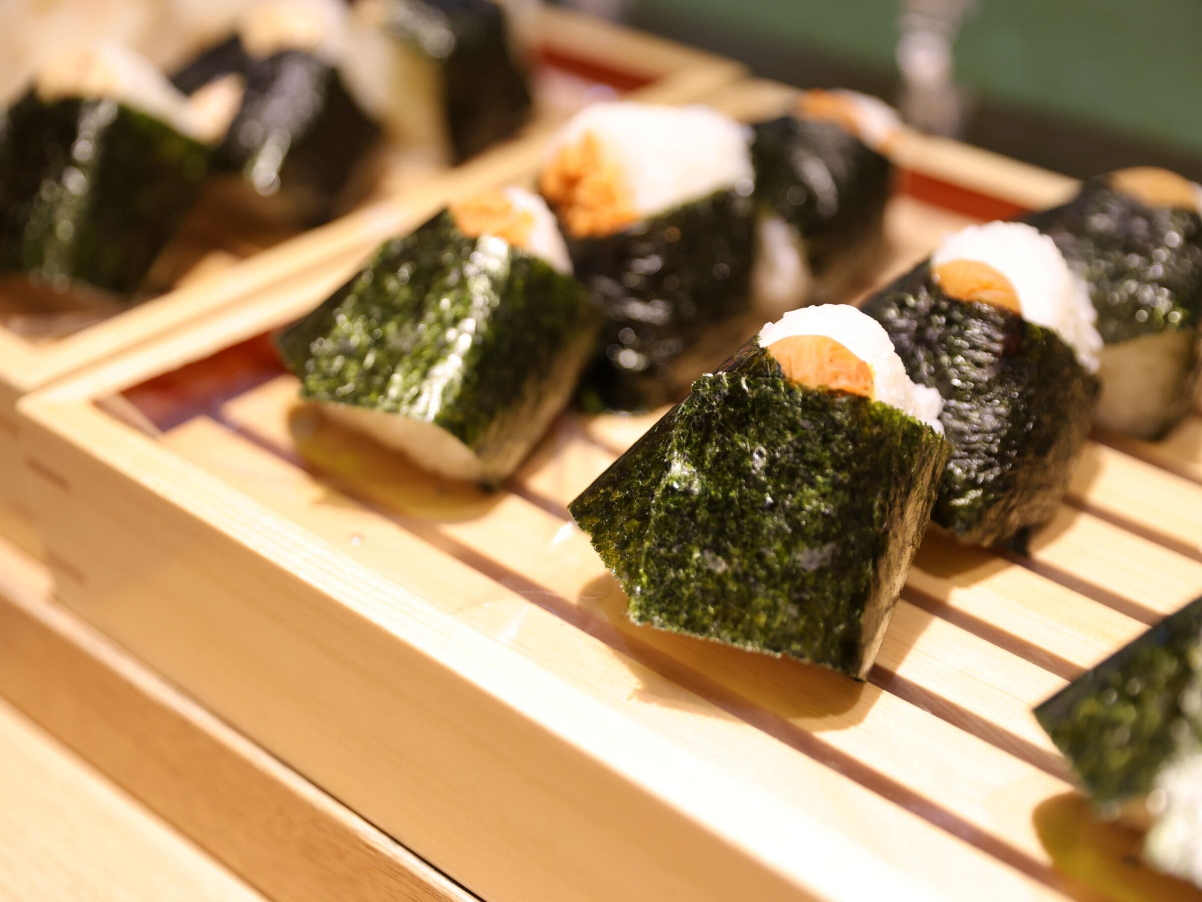 Sushi on wooden blocks.