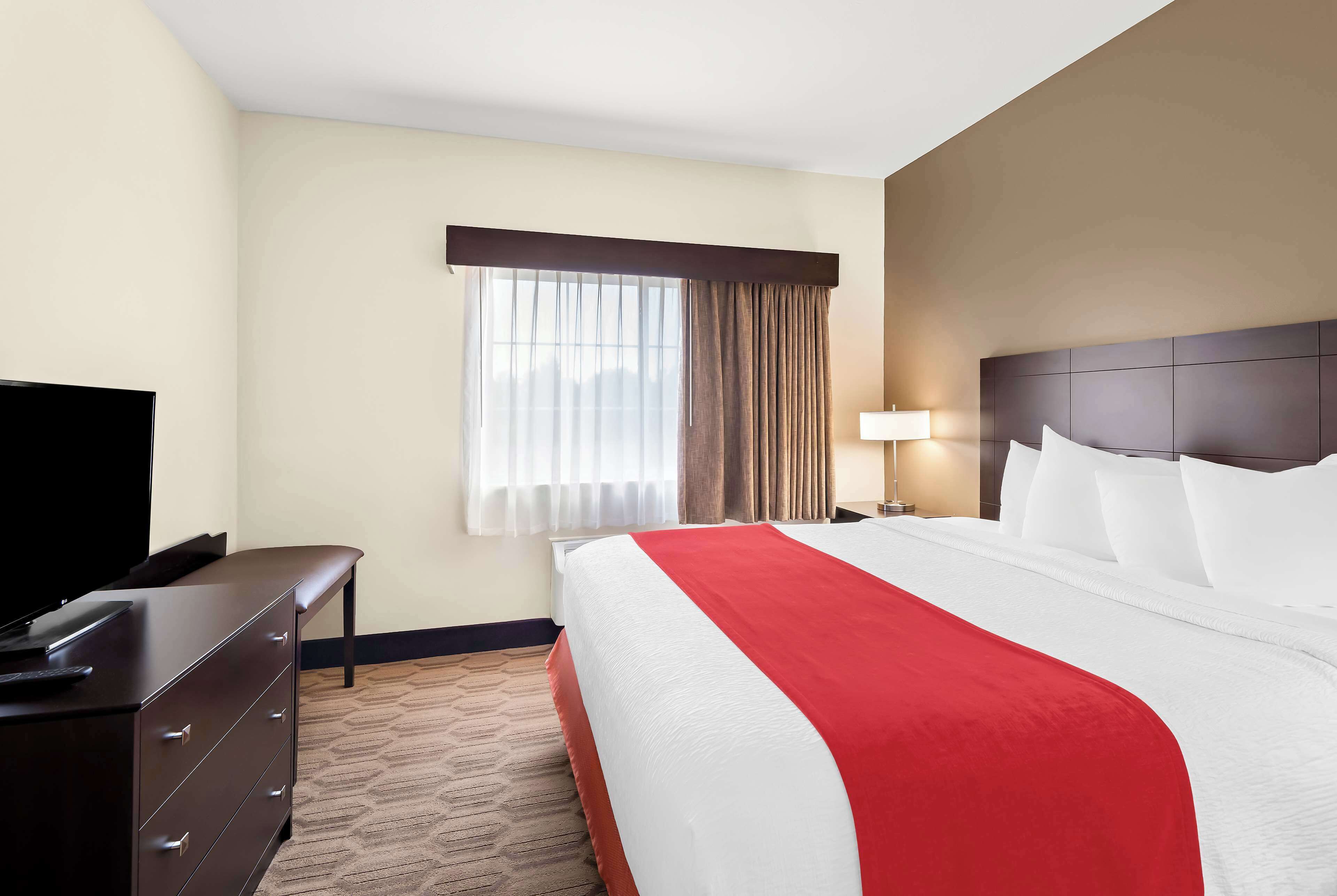 Desk, laptop workspace, iron/ironing board, cribs/infant beds