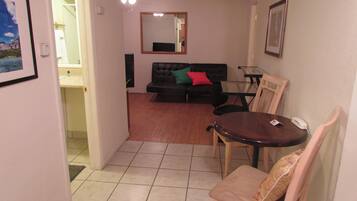 Deluxe Room, 1 Bedroom, Kitchenette | Living area | TV