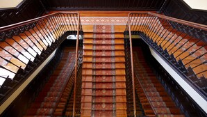 A grand staircase with ornate railings and patterned carpet. - Gran Hotel Balneario de Cestona (Zestoa)