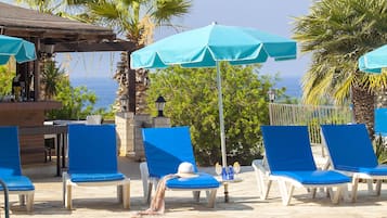 Outdoor pool, free cabanas, pool umbrellas