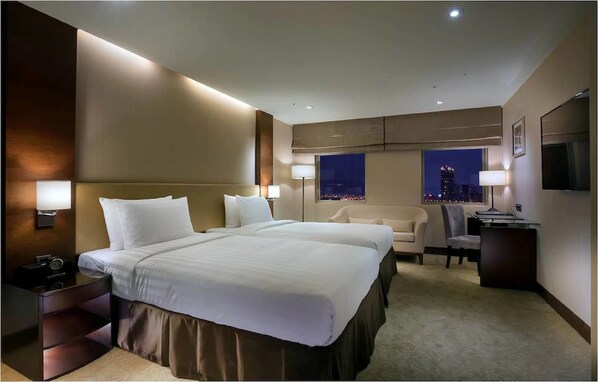 Habitación Deluxe con 2 camas individuales | Ropa de cama de alta calidad y edredón 