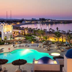 Outdoor pool, pool umbrellas, lifeguards on site
