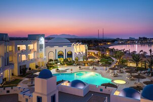 Outdoor pool, pool umbrellas, lifeguards on site