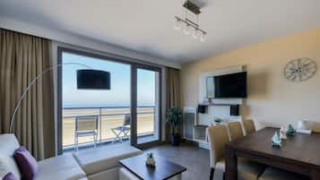 Apartment, 2 Bedrooms | Living room | Flat-screen TV