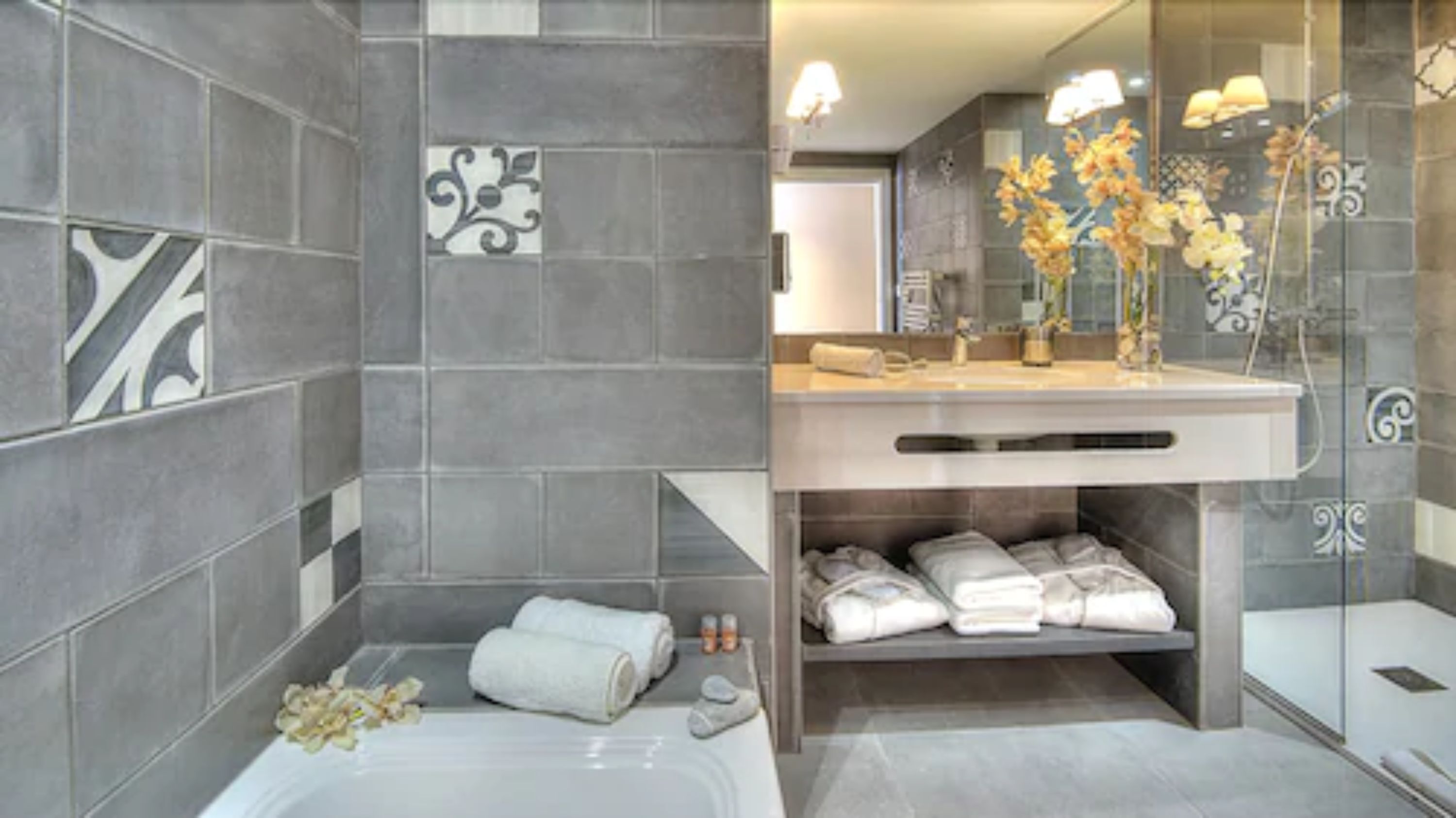 designer toiletries, hair dryer, bathrobes, slippers