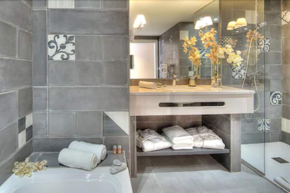 Designer toiletries, hair dryer, bathrobes, slippers