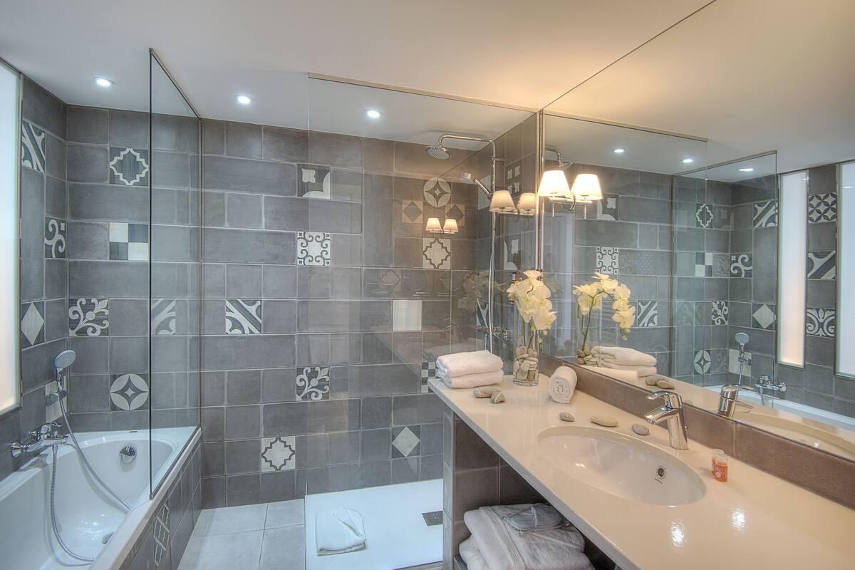 designer toiletries, hair dryer, bathrobes, slippers