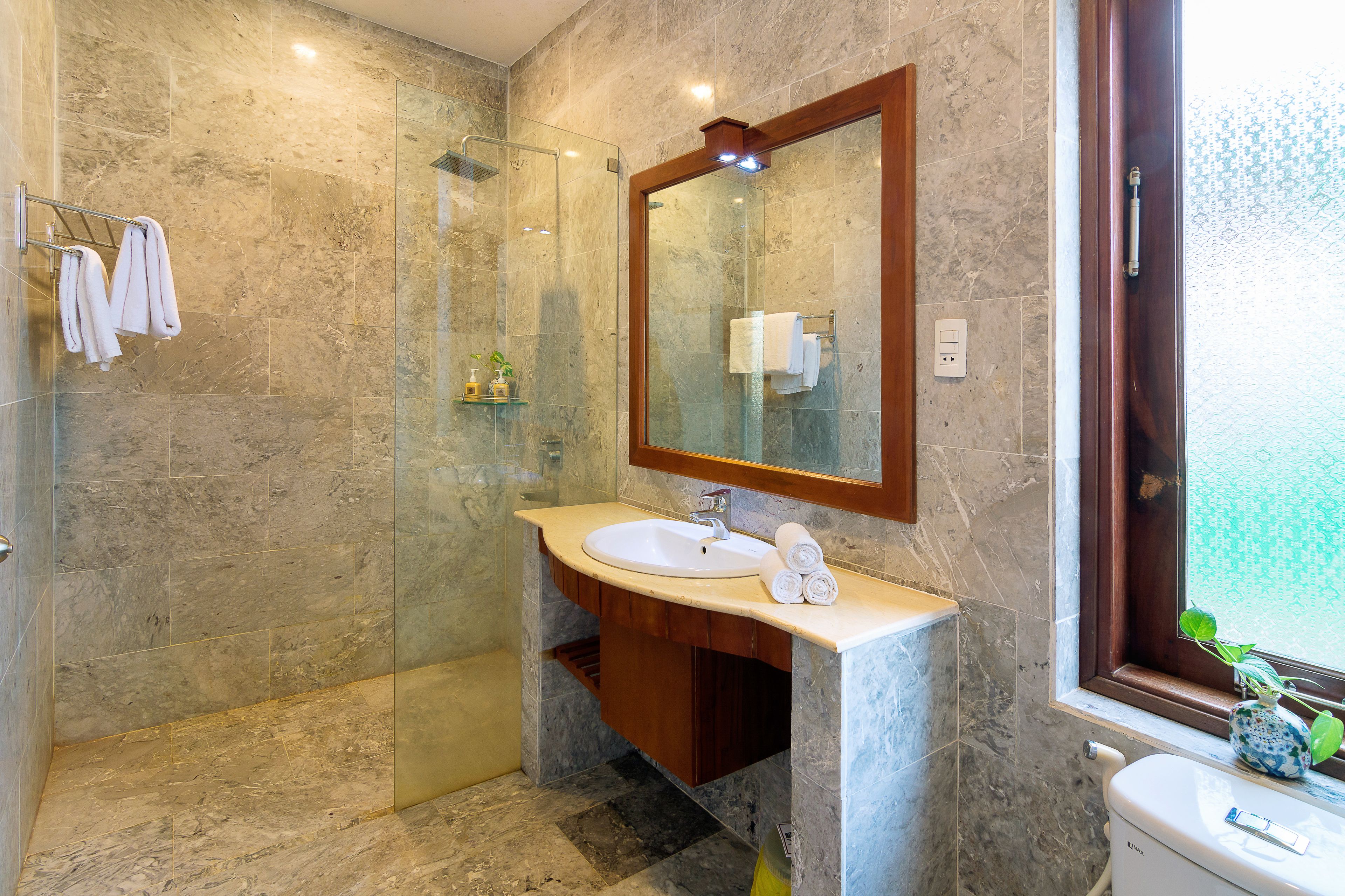 deluxe triple room | bathroom | shower, free toiletries, hair dryer, slippers