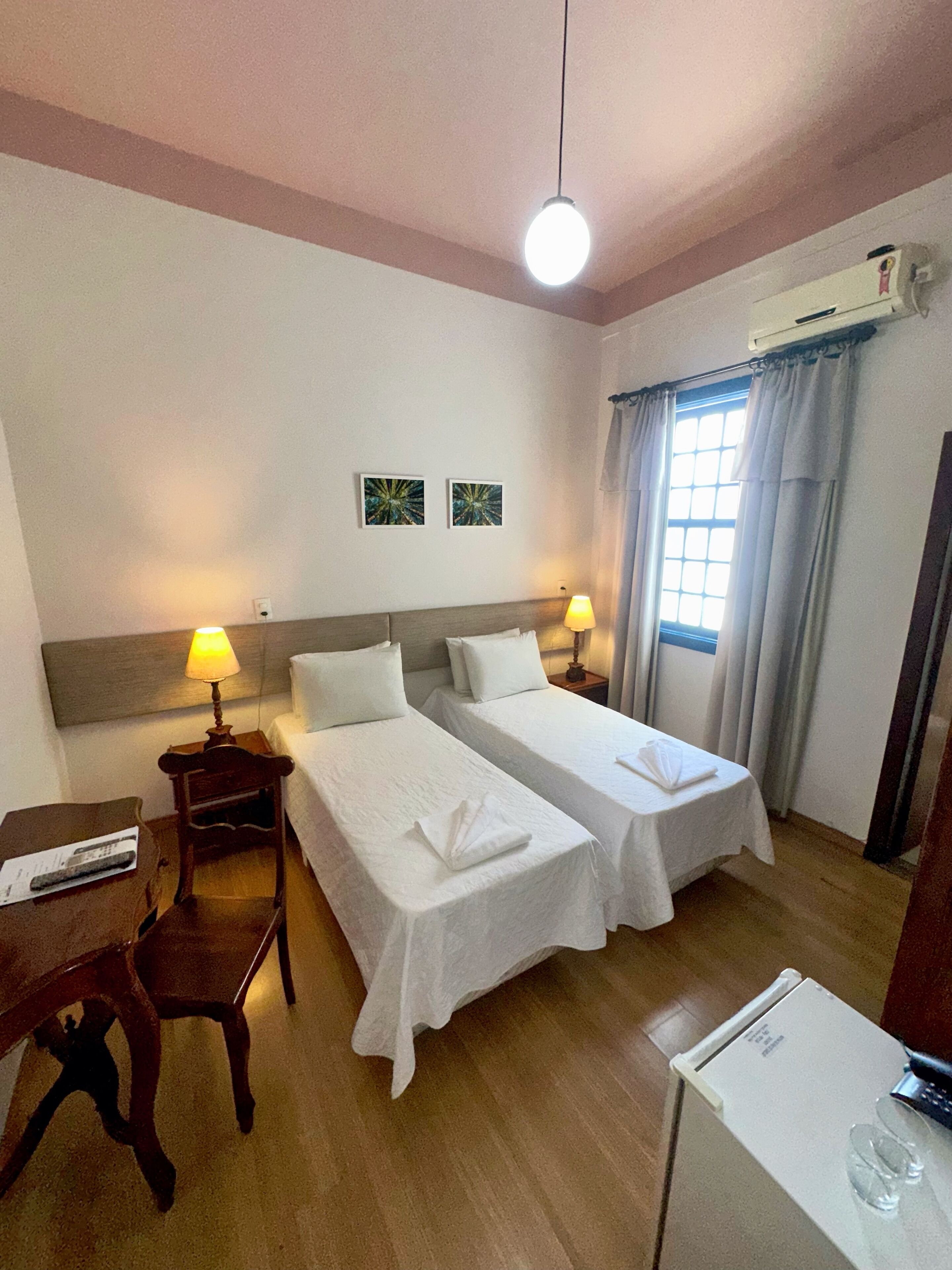 Standard Twin Room | Minibar, desk, laptop workspace, blackout curtains