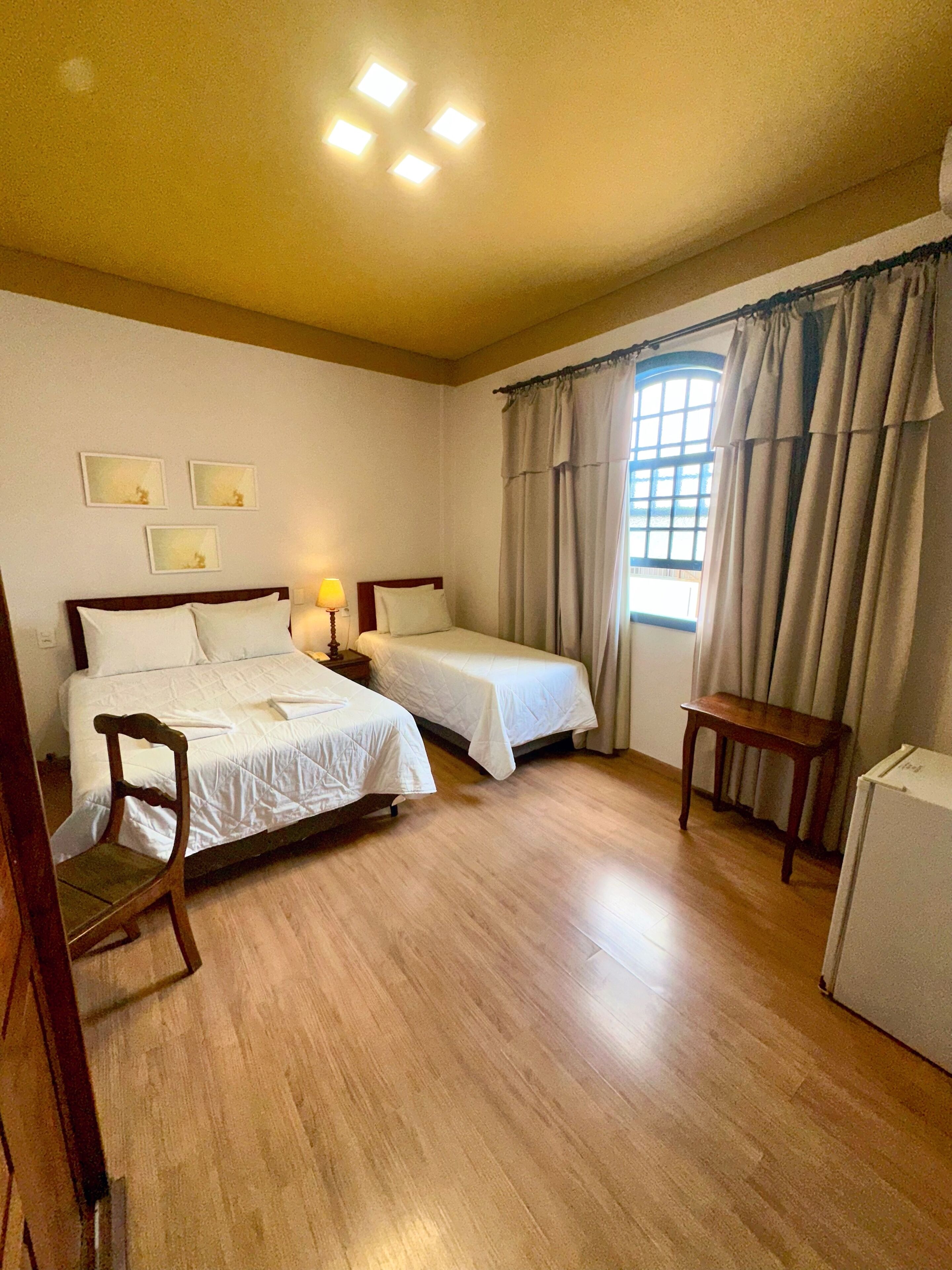 Standard Triple Room | Minibar, desk, laptop workspace, blackout curtains