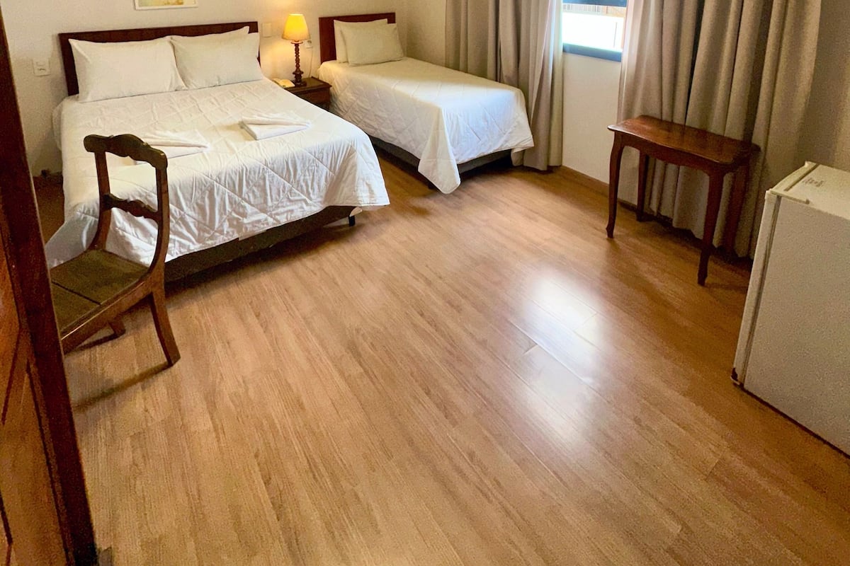 Standard Triple Room | Minibar, desk, laptop workspace, blackout curtains