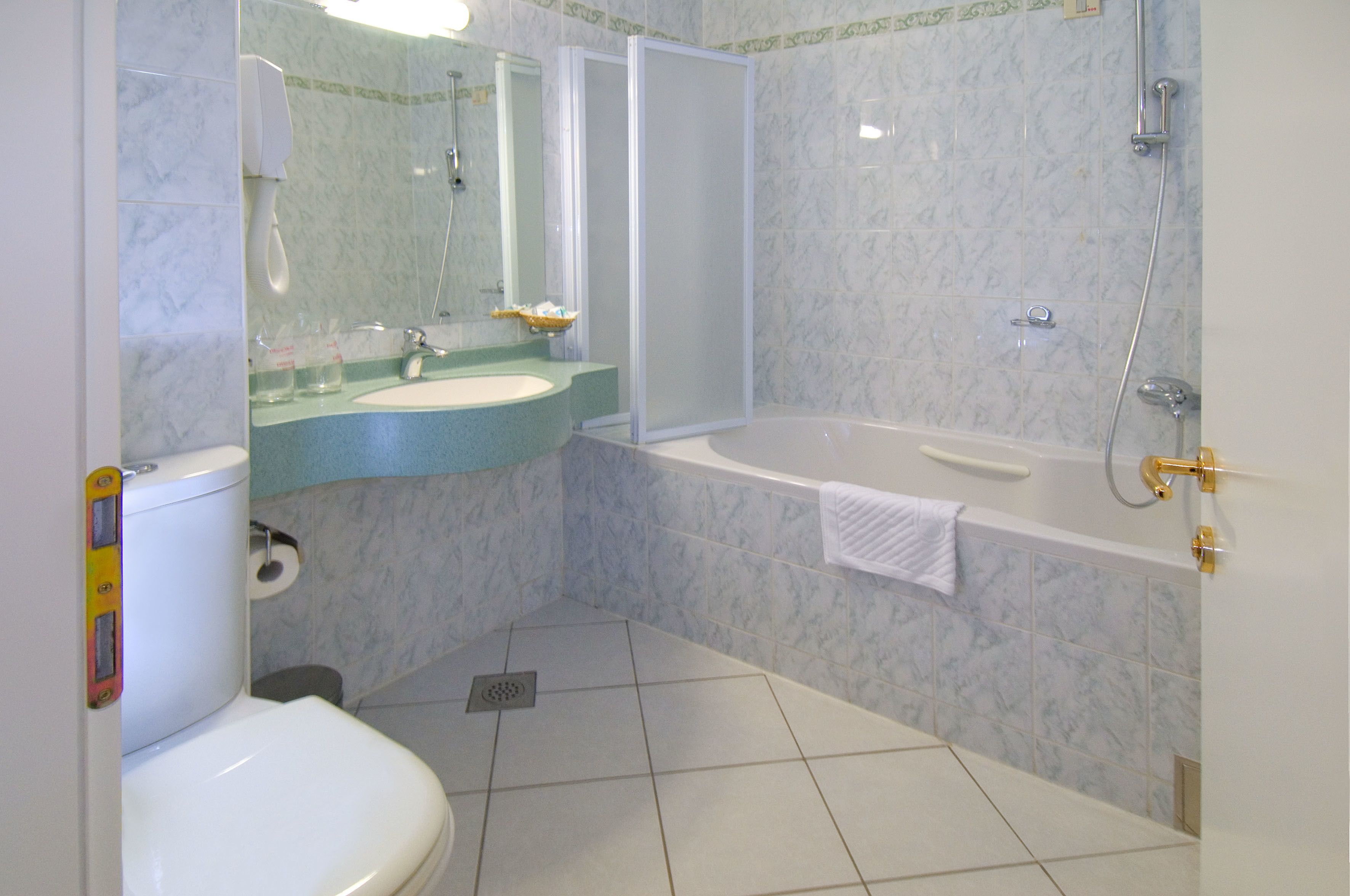 family studio suite | bathroom | hair dryer, slippers, towels