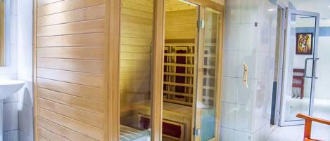 A wooden room with a sliding glass door leading to a storage area.