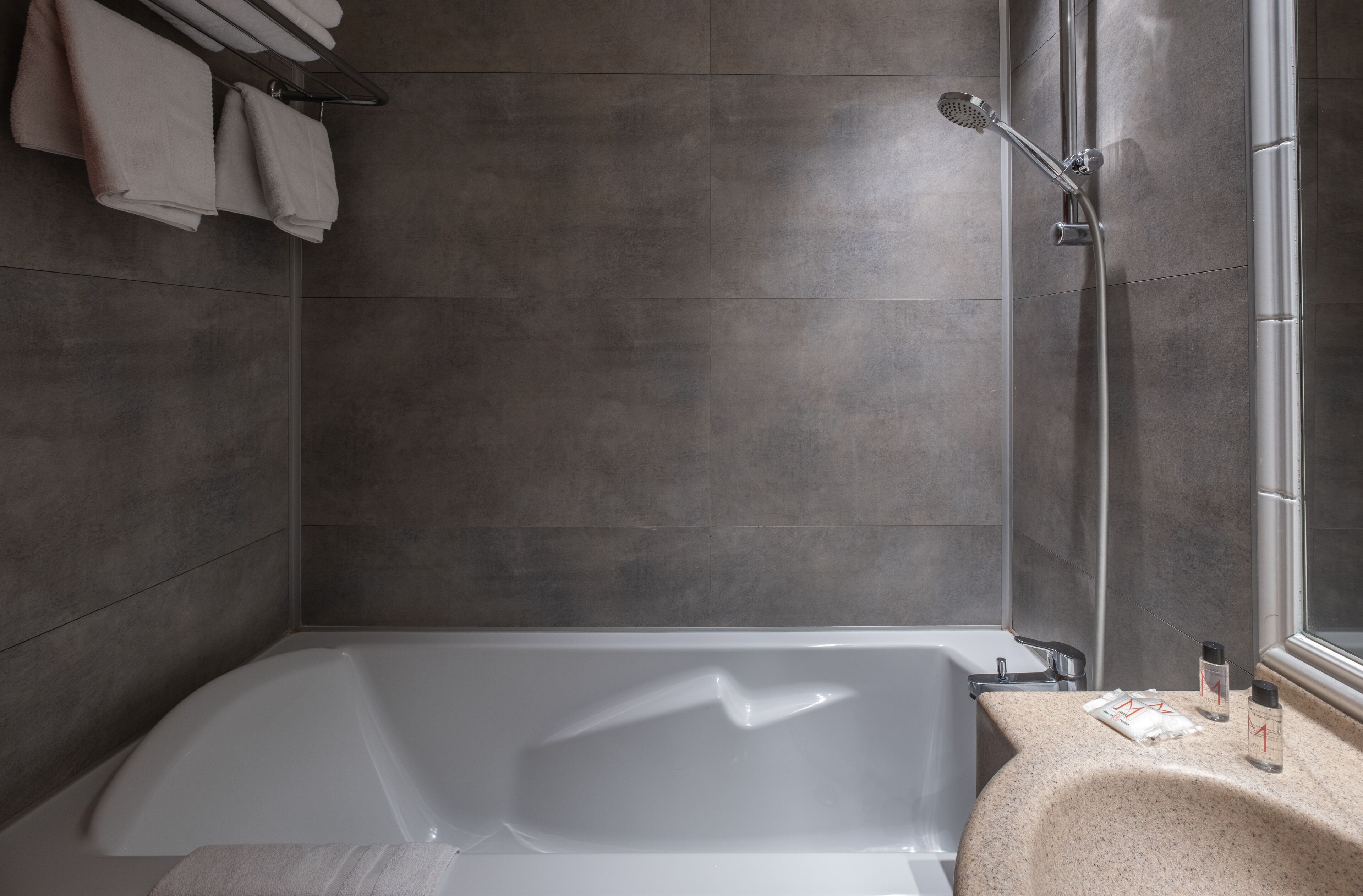 bathtub, free toiletries, hair dryer, towels