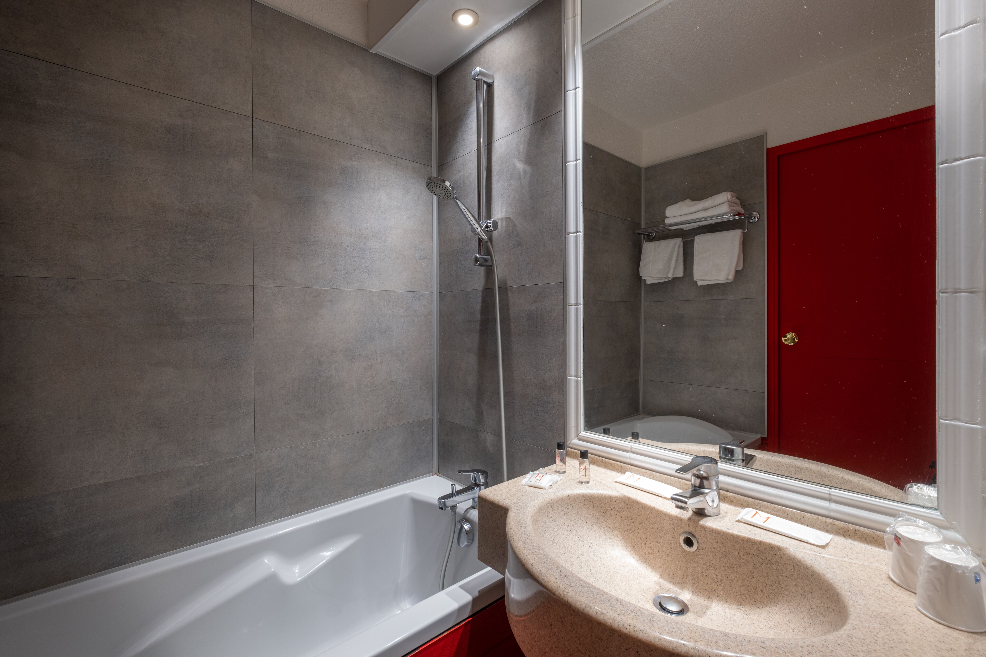 bathtub, free toiletries, hair dryer, towels