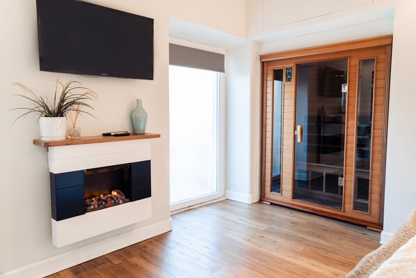 Romantik-studiosuite - sauna | Dundyner, gratis produkter i minibaren, pengeskab på værelset