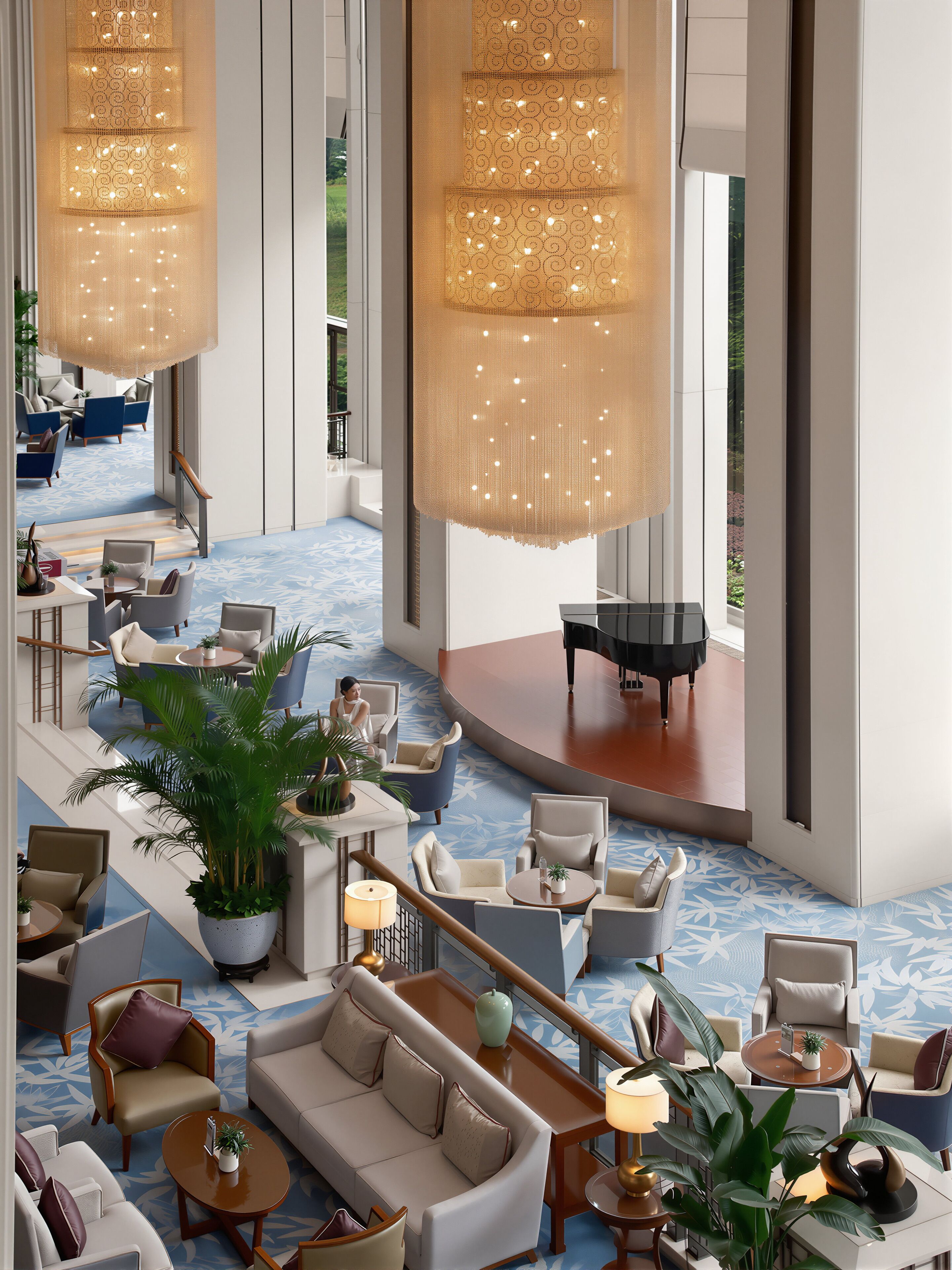 A spacious lobby with a grand piano, multiple seating areas, and large hanging chandeliers.