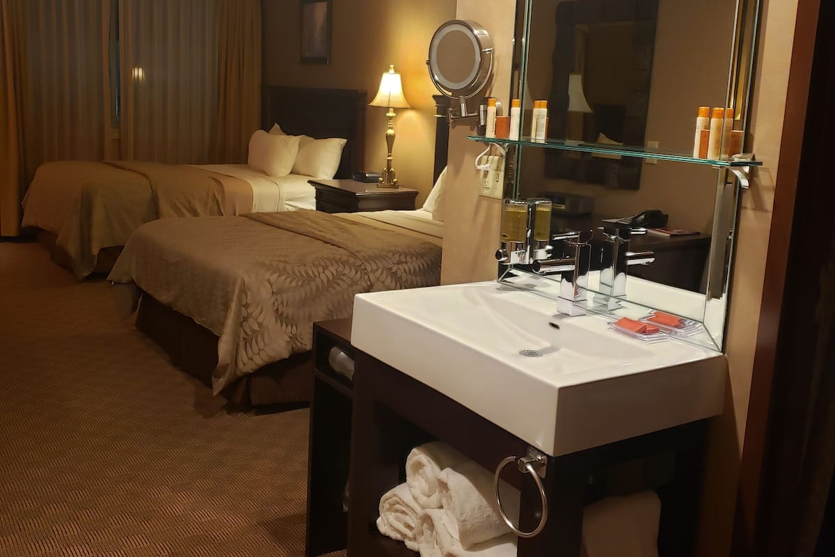 standard room, 2 queen beds, non smoking | in-room safe, desk, laptop workspace, soundproofing