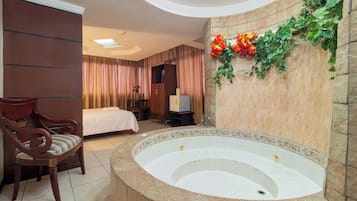 Premium Suite, 1 King Bed, Jetted Tub | 1 bedroom, down duvets, iron/ironing board, free WiFi