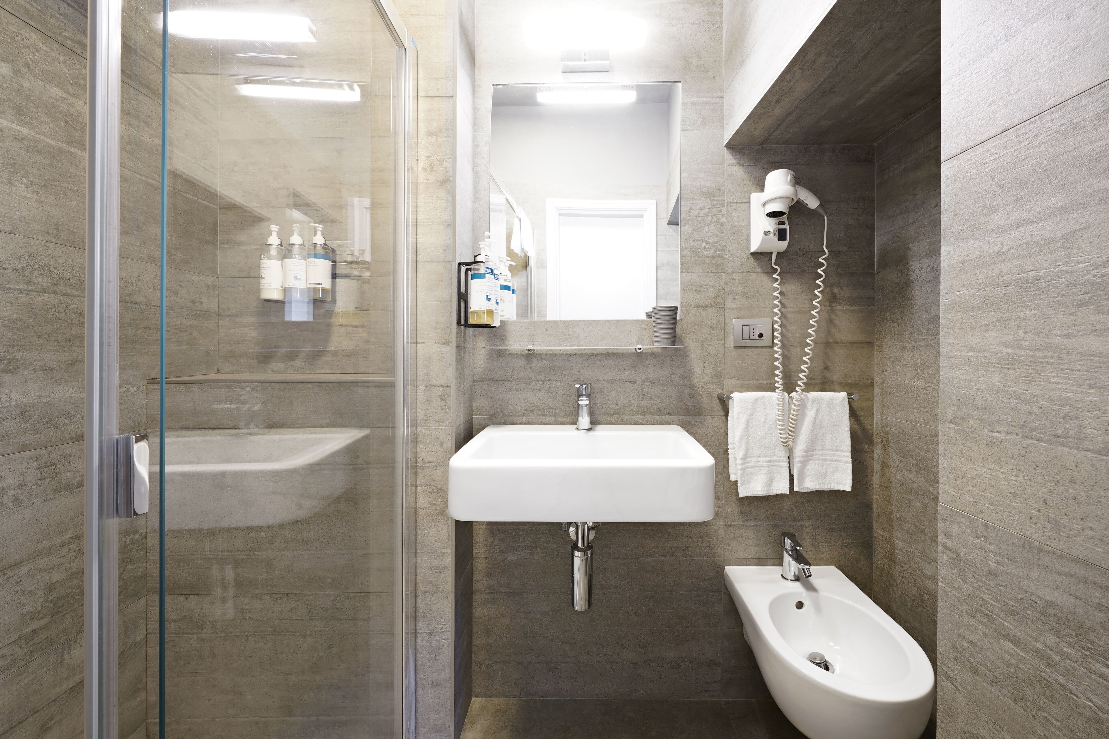 standard room | bathroom | shower, rainfall showerhead, designer toiletries, hair dryer