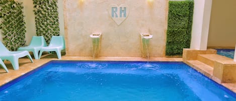 Indoor pool, outdoor pool, open 9 AM to 8 PM, pool loungers