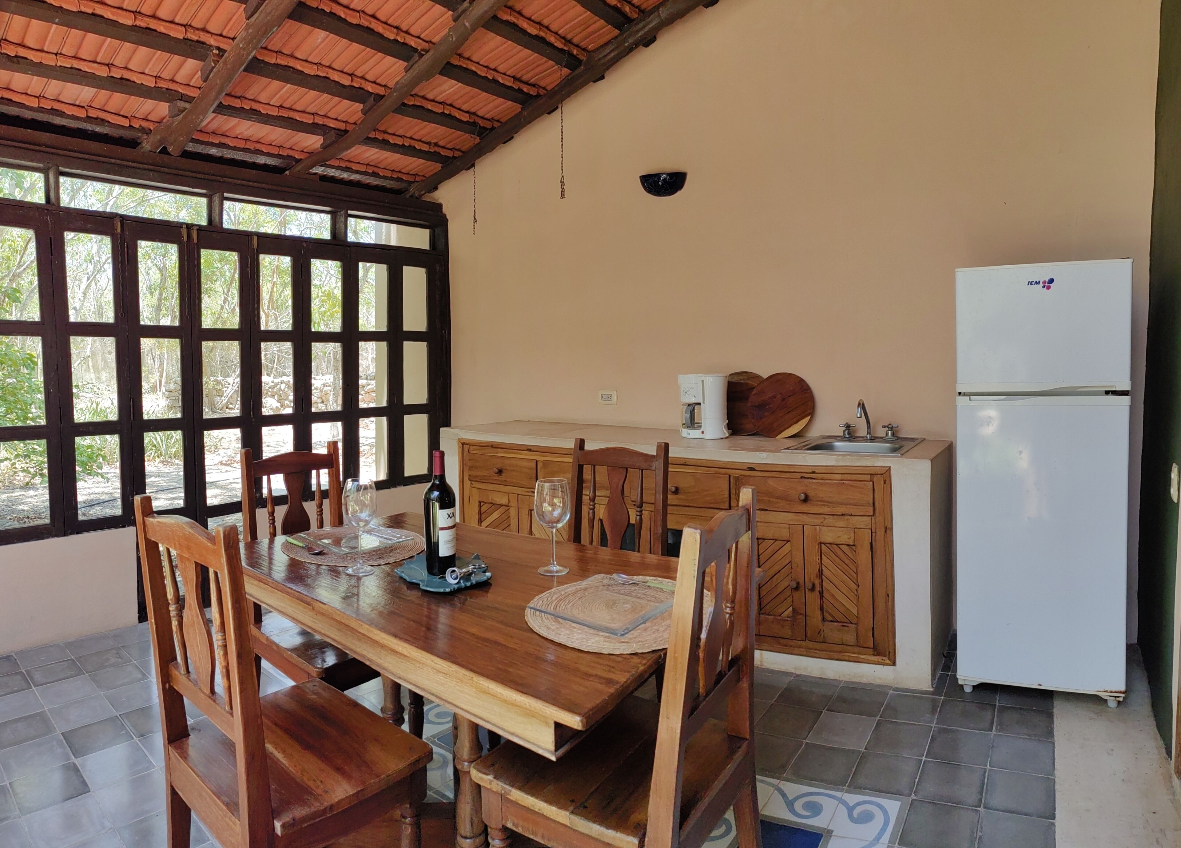 junior villa, 1 queen bed | private kitchen | fridge, coffee/tea maker, cookware/dishes/utensils, dining tables