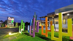 A modern building with a sign reading "The Oasis." - The Oasis Resort (Krabi)