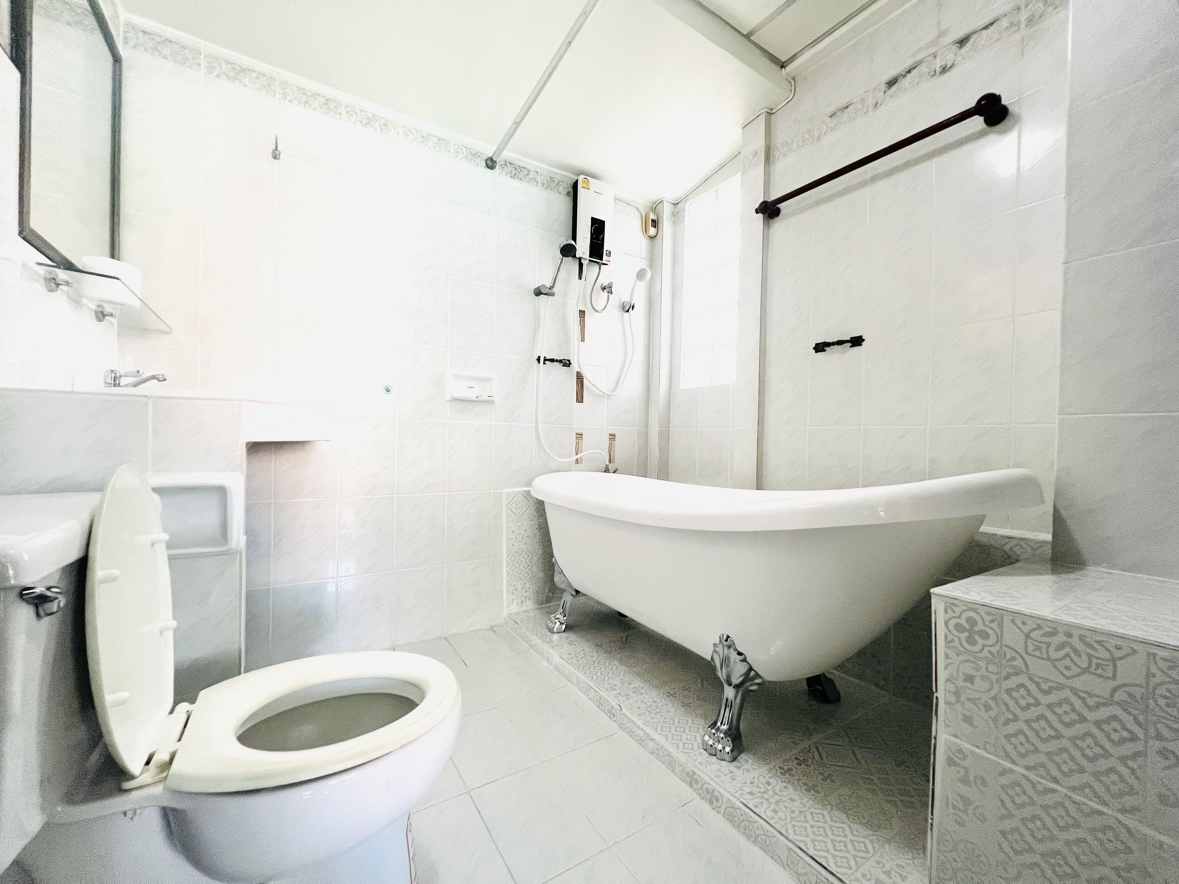 deluxe family room | bathroom | shower, bidet, towels, soap