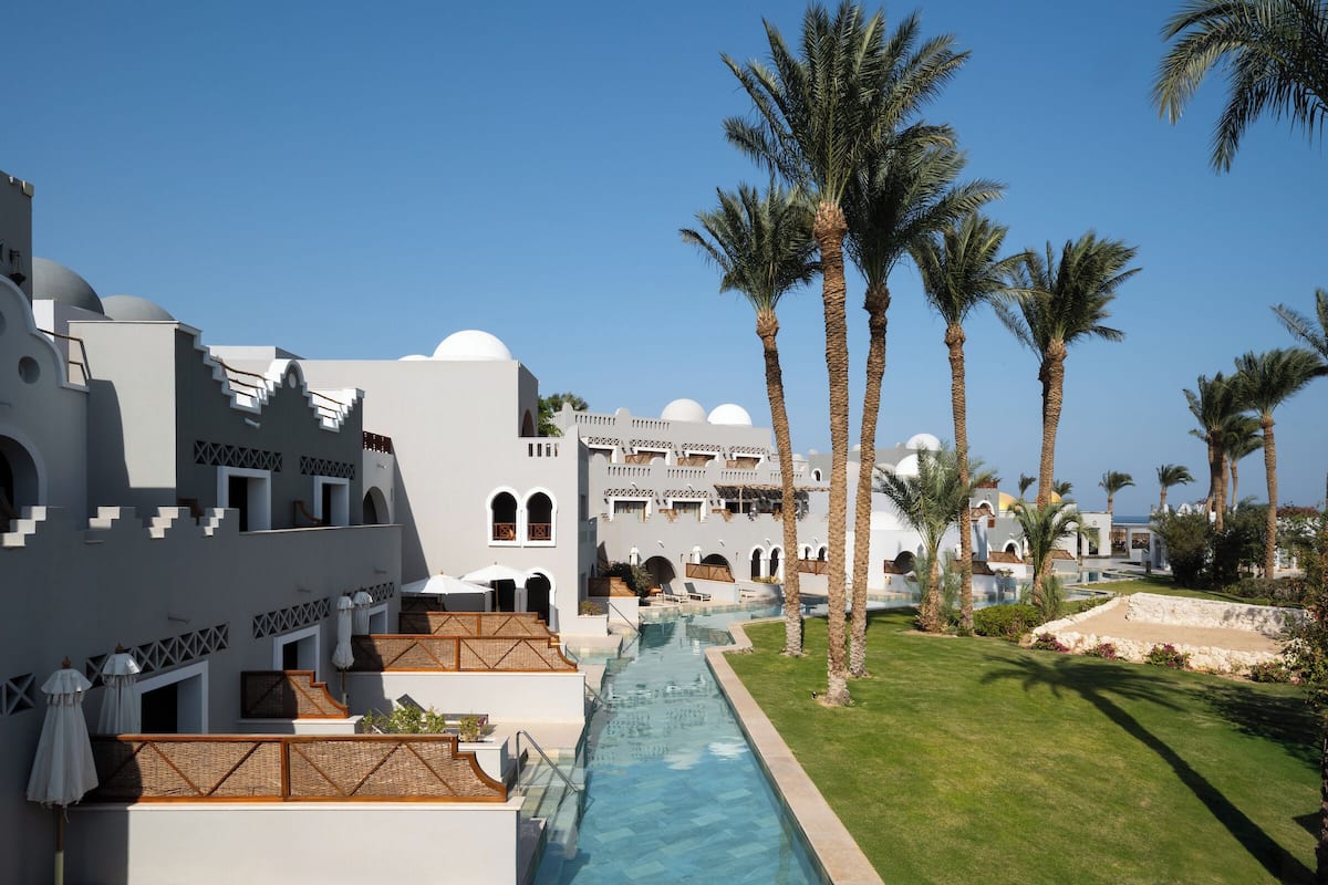 Junior Suite, Pool Access | Minibar, in-room safe, iron/ironing board, bed sheets