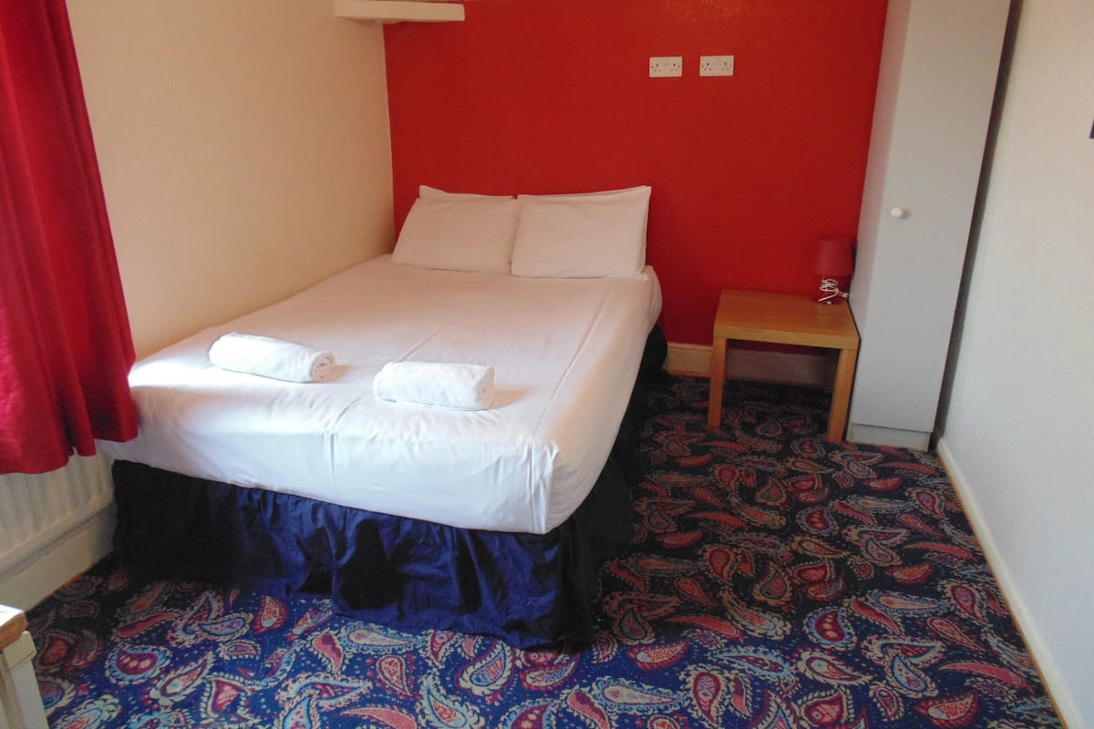 Double Room | Iron/ironing board (on request), bed sheets