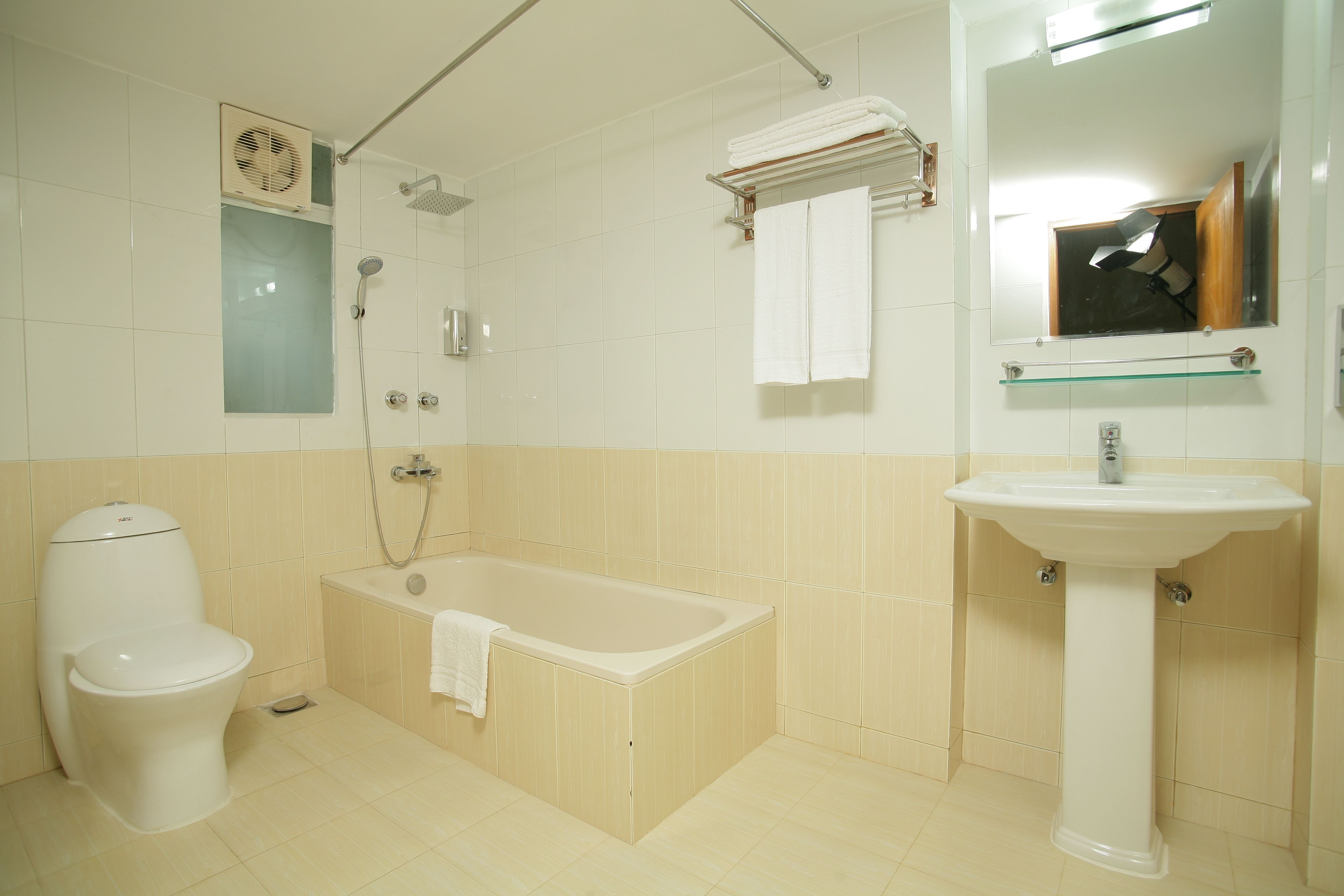 designer toiletries, hair dryer, slippers, towels