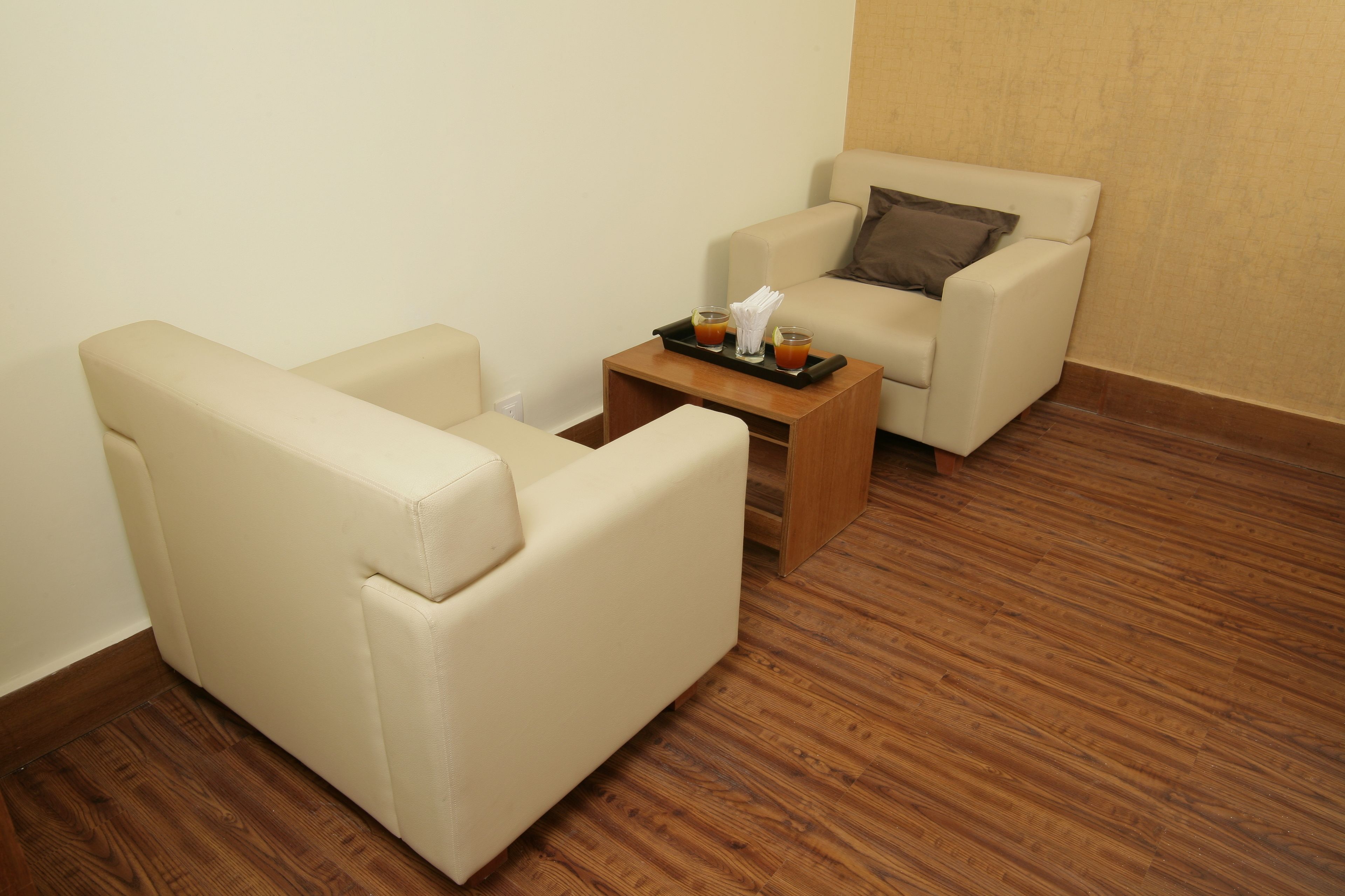 city studio suite (city view) | living area | flat-screen tv