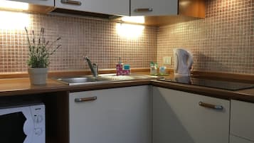 Apartment, 1 Bedroom (max 3) | Private kitchen | Full-size fridge, microwave, stovetop, coffee/tea maker