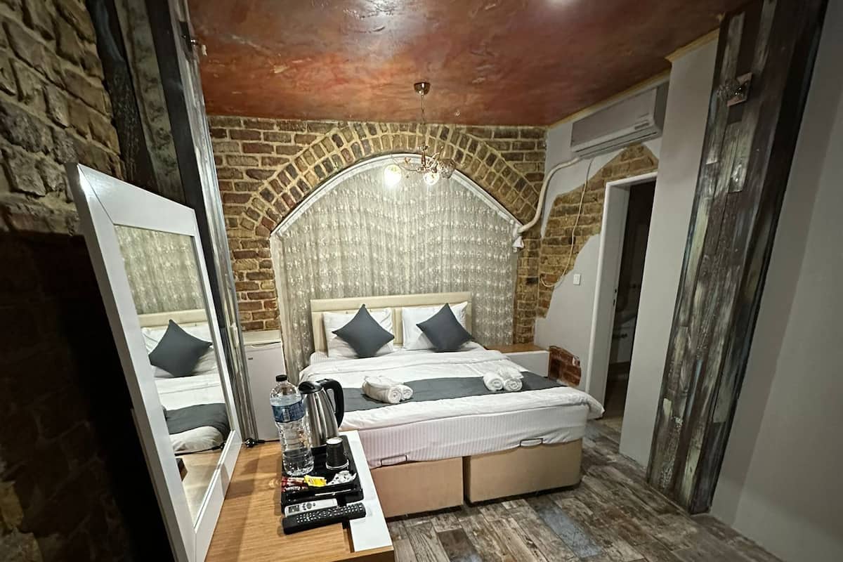 Habitación familiar | Ropa de cama de alta calidad y minibar