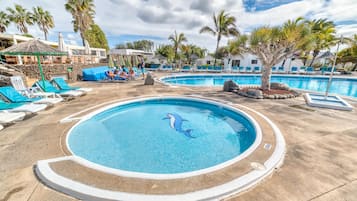 Outdoor pool, open 8 AM to 6 PM, pool umbrellas, sun loungers