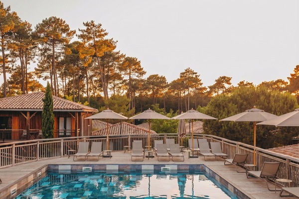 Seasonal outdoor pool, open 10:00 AM to 9:00 PM, pool umbrellas
