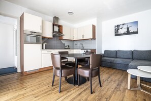 Studio Suite | Desk, laptop workspace, blackout drapes, iron/ironing board