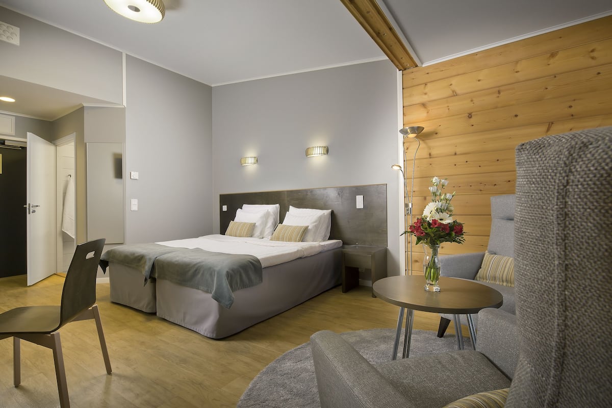 superior double room, 1 king bed | living area | flat-screen tv