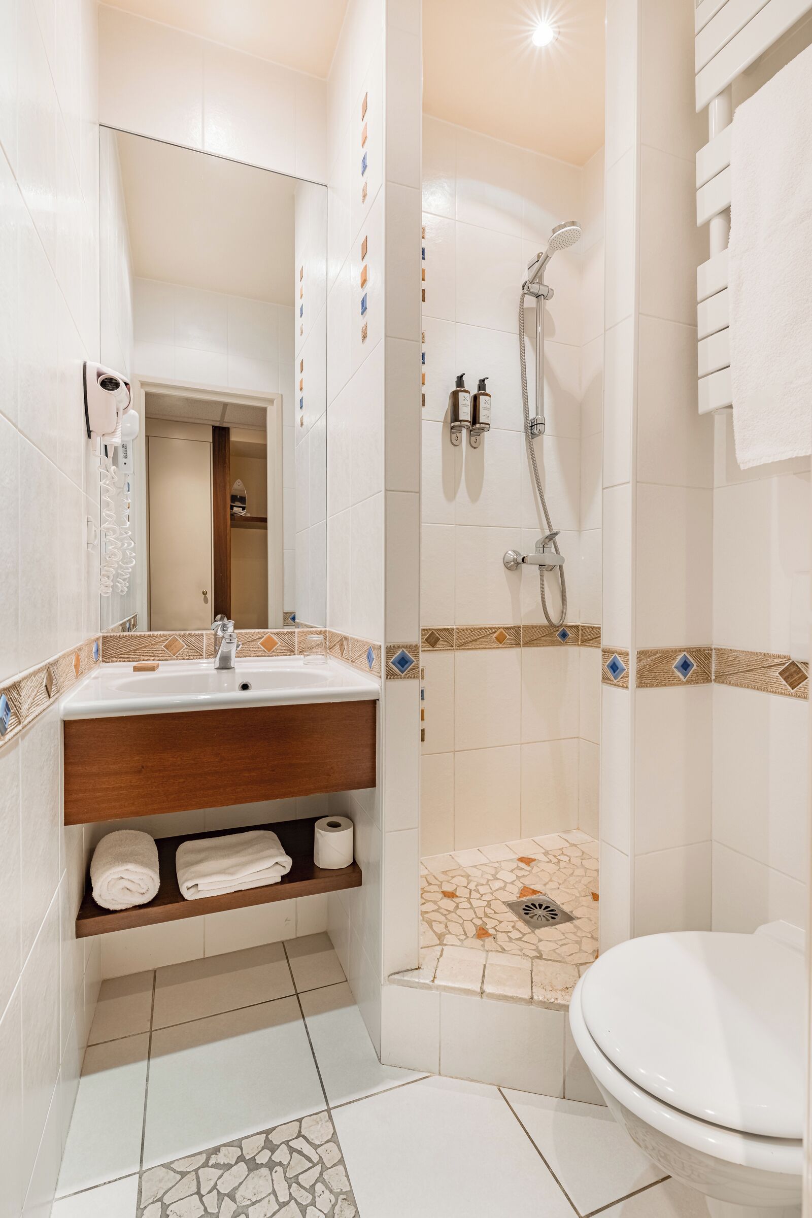 economy single room | bathroom | hair dryer, towels, soap, shampoo
