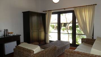 Family Garden Cottage (1 Double Bed + Two Single Beds) | Living area | 32-inch TV with satellite channels