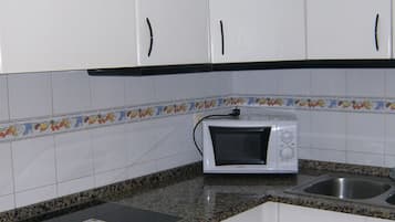 Apartment, 1 Bedroom | Private kitchen | Fridge, microwave, stovetop, cookware/dishes/utensils