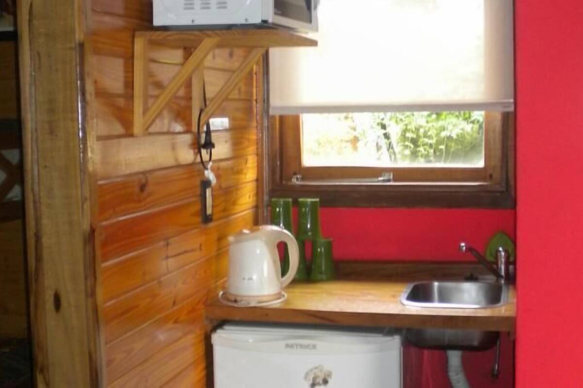 Fridge, microwave, coffee/tea maker, cookware/dishes/utensils
