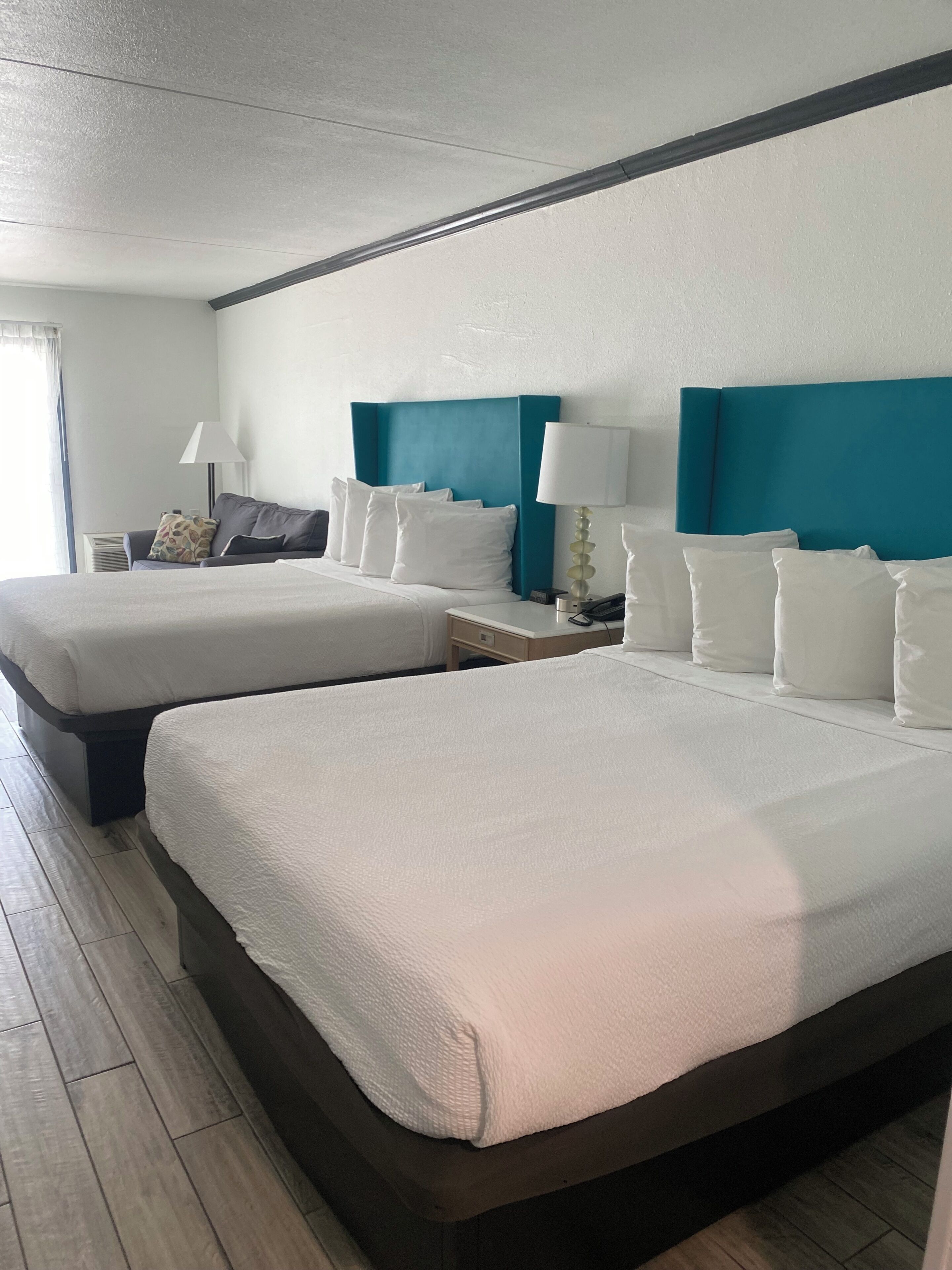 Premium bedding, blackout curtains, soundproofing, iron/ironing board
