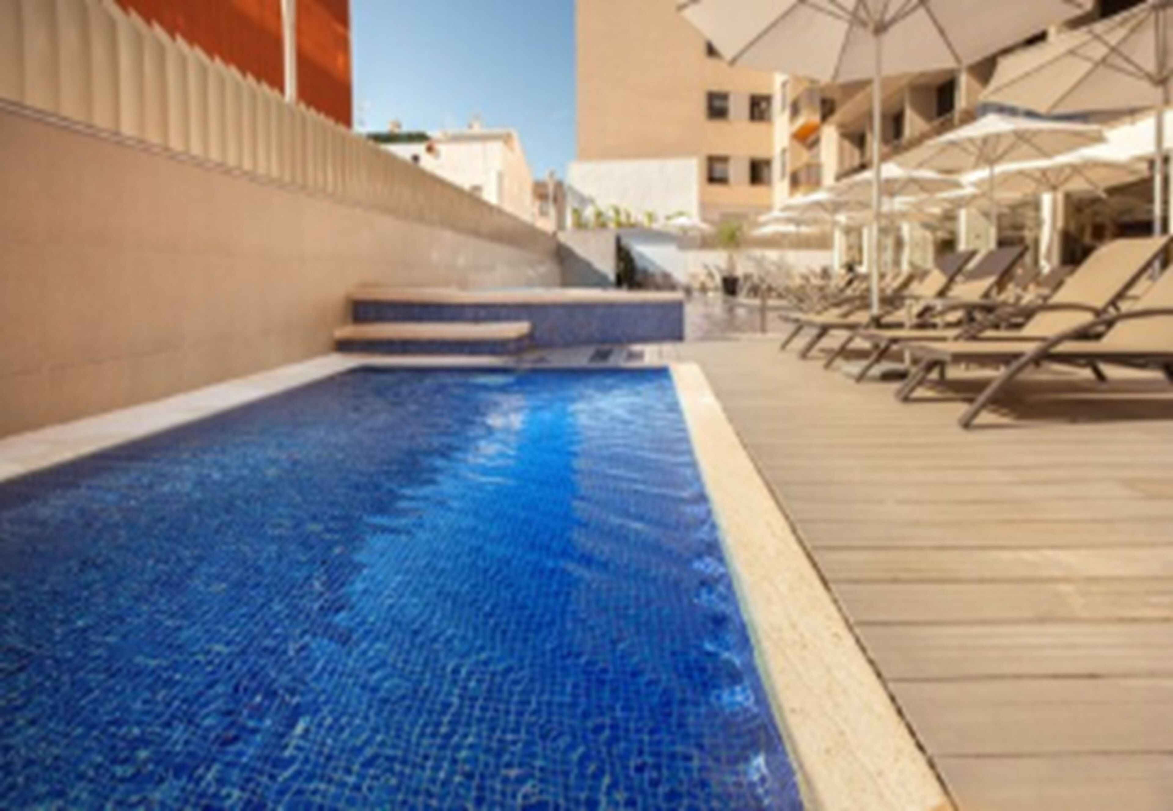 outdoor pool, open 9:30 am to 8 pm, pool loungers