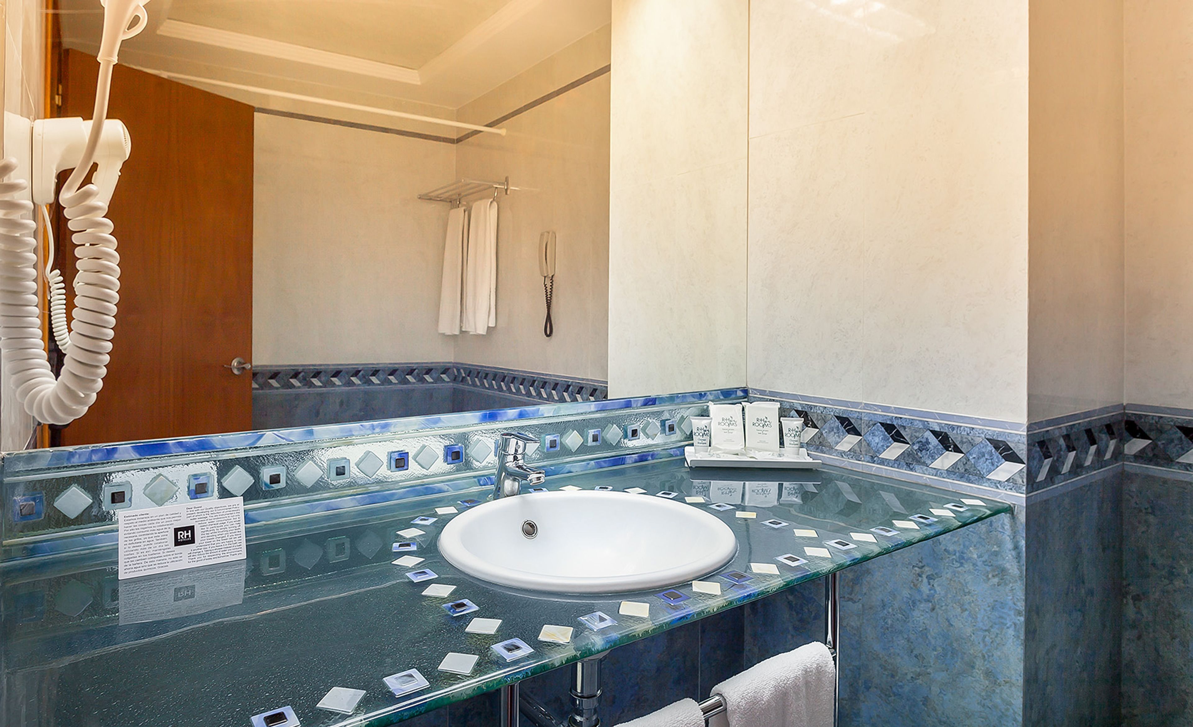 bathtub, free toiletries, hair dryer, towels