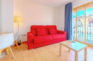Apartamento, 1 quarto | Área de estar | TV de tela plana