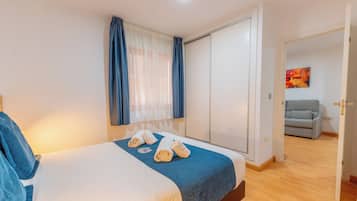 Apartment, 1 Bedroom | 1 bedroom, blackout drapes, iron/ironing board, free cribs/infant beds